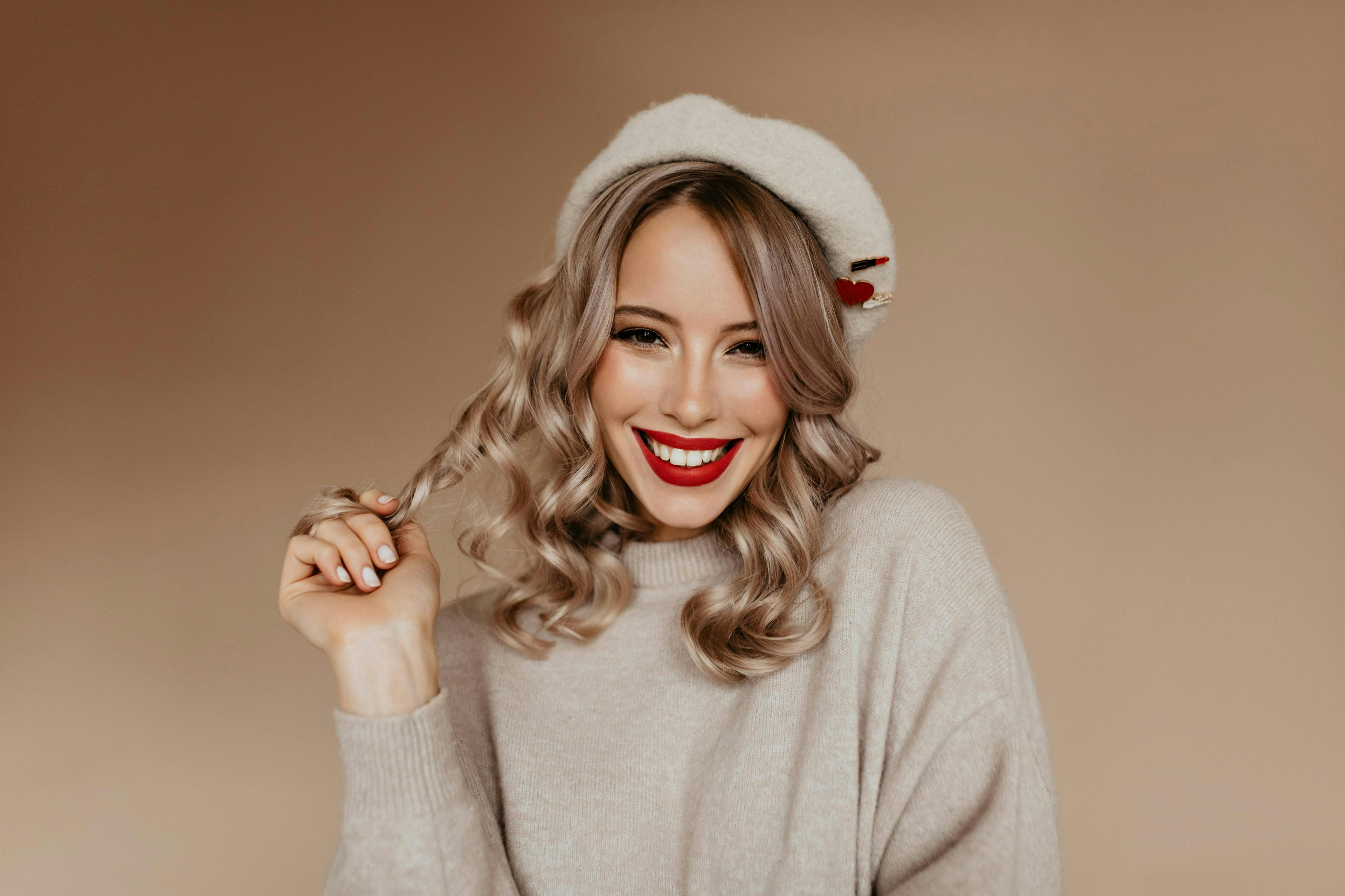 woman sweater smile blonde hat wool fashion girl young winter beautiful style sensual white female pretty portrait happy casual season model adult cute curly vogue people face beauty attractive cheerful glamour cold cap lifestyle stylish studio cashmere wintertime fashionable x-mas autumn enjoy cardigan romantic fair-haired indoor positive laugh beige beret clothing apparel person human sleeve