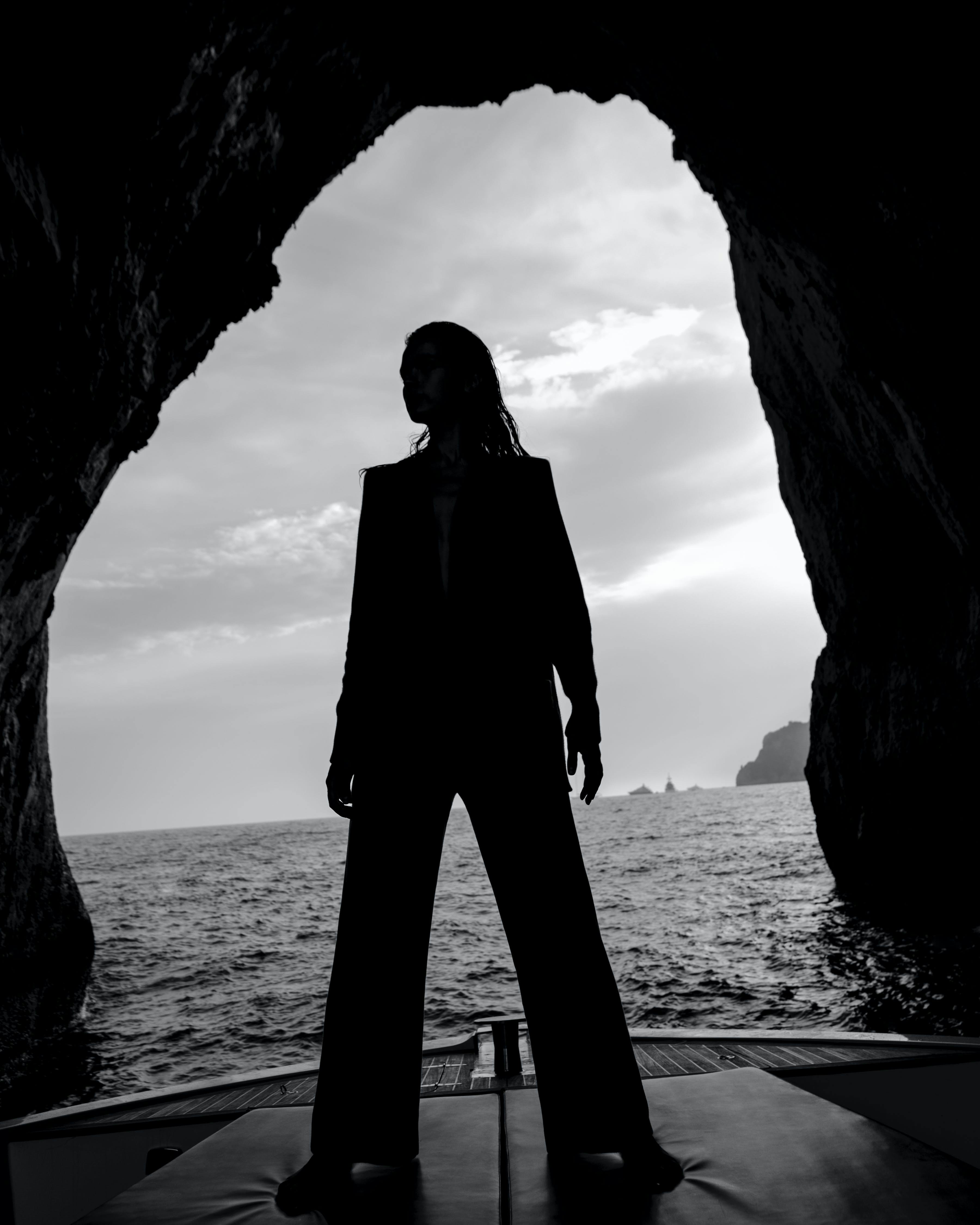 silhouette standing person human nature cave outdoors water sea ocean