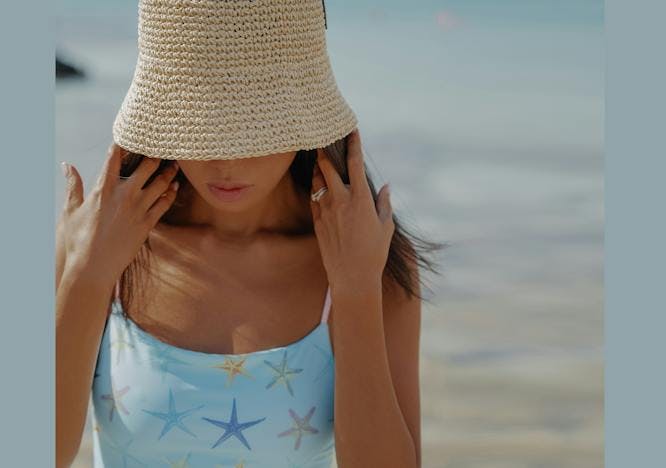 clothing hat sun hat beachwear person face head