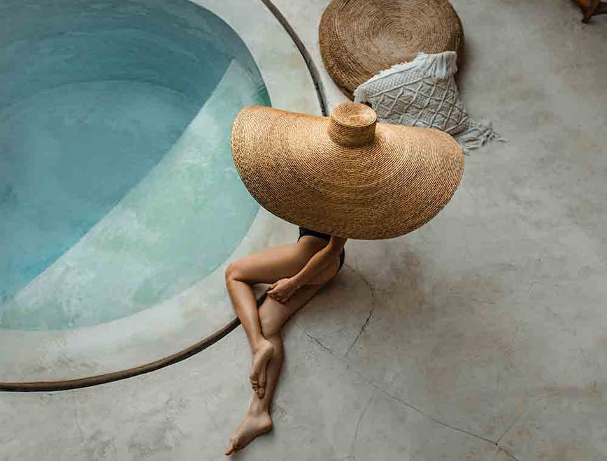 clothing hat sun hat pool water