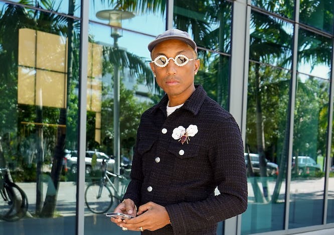 brooch,celebrity,sunglasses,famous,hollywood,pharrell williams,entertainment,street style,hats,2022,art basel,portrait,miami,pharrell,pearls,street,style,black and white,man,event,fashion person standing ring adult male man pants formal wear shoe bicycle