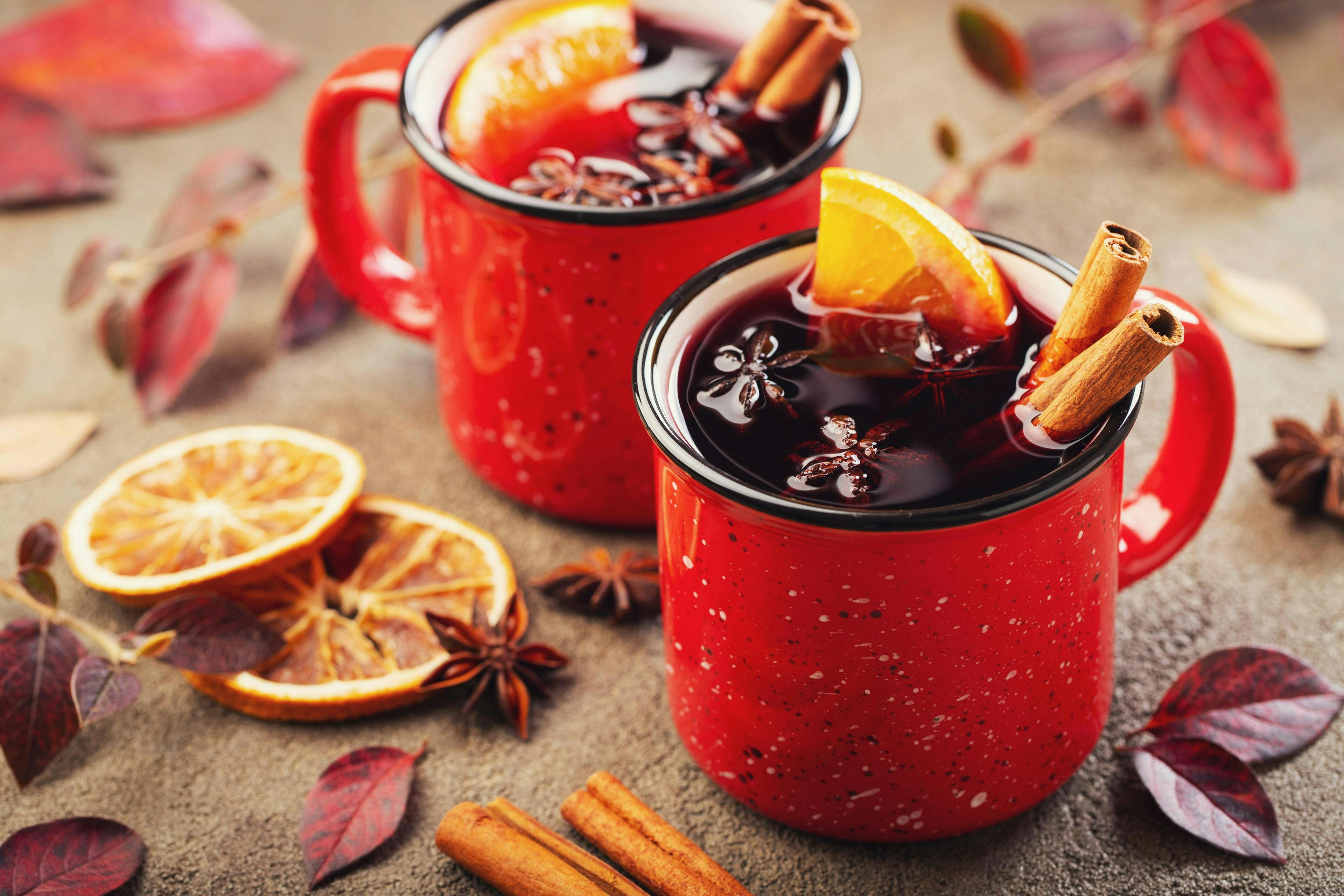 spice,wintertime,fir,red,leave,above,decoration,alcohol,anise,warmth,overhead,tree,aromatic,drink,celebration,sticks,background,vintage,autumn,card,mug,wine,cup,cinnamon,fruit,recipe,winter,hot,holiday,two,punch,rustic,glogg,cocktail,beverage,kitchen,table,garland,mulled,star,advent,festive,comfort,food,lifestyle,stone,orange,dessert,gluhwein,evening cup